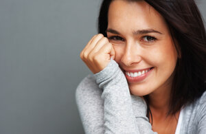 woman smiling with white teeth, teeth whitening treatment Portland, OR